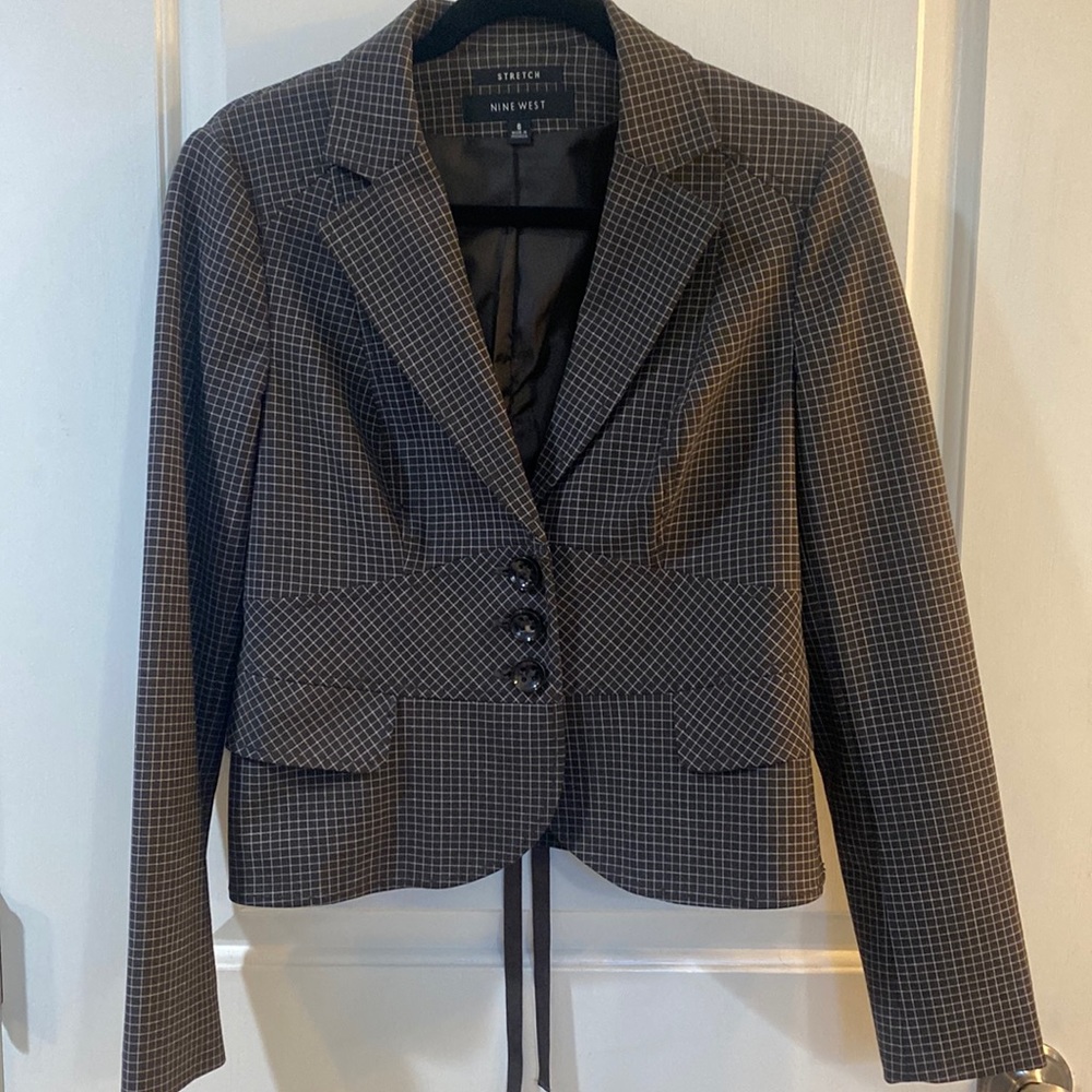 Dark brown checked jacket.